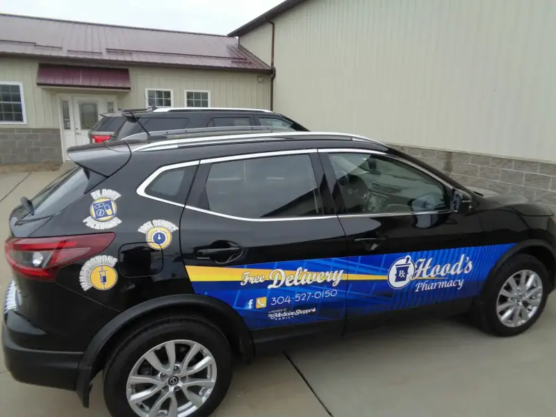 Hood's Pharmacy delivery vehicle with printed vehicle graphics by Signs Limited